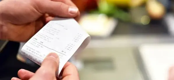A flat-lay or mockup of a professional-looking receipt with company details and logo visible.
