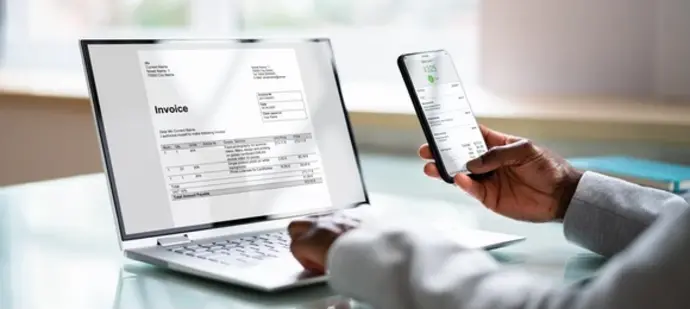 An image of a laptop screen showing digital invoices